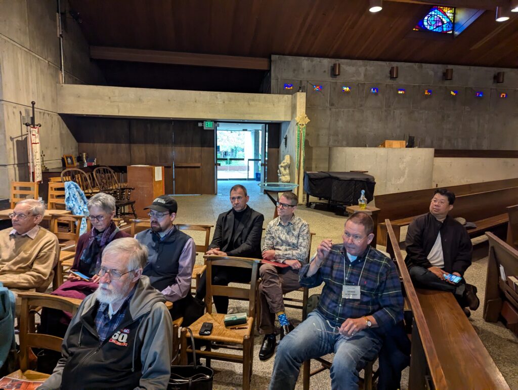 A group of people is seated in a church.